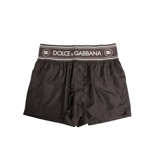 Dolce & Gabbana Brown Polyester Logo Elastic Waistband Swimwear, stylish swim shorts with branded waistband, perfect for beach or poolside wear.