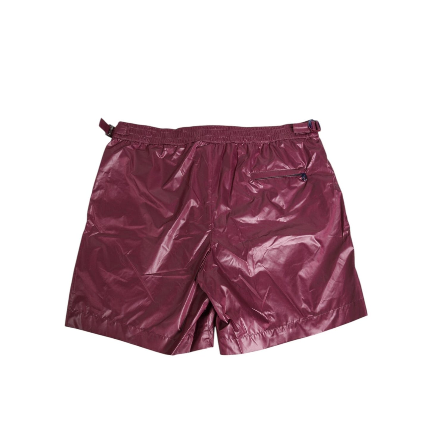 Dolce & Gabbana Burgundy Polyester Logo Embossed Crest Swimwear with glossy finish and embroidered crest. Crafted in Italy.
