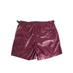 Dolce & Gabbana Burgundy Polyester Logo Embossed Crest Swimwear with glossy finish and embroidered crest. Crafted in Italy.