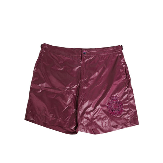 Dolce & Gabbana Burgundy Polyester Logo Embossed Crest Swimwear, glossy finish, embroidered DG crest.