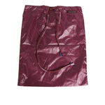 Dolce & Gabbana Burgundy Polyester Logo Embossed Crest Swimwear glossy finish with iconic DG embroidered crest on drawstring bag.