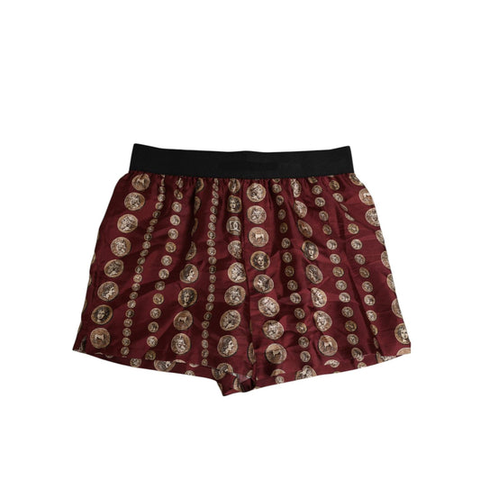 Dolce & Gabbana Burgundy Silk Coin Print Men Boxer Short Swimwear with elastic waistband and ancient coin pattern.