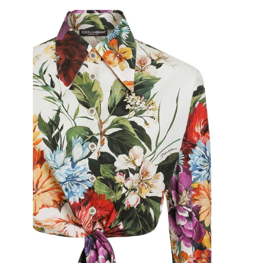 Dolce & Gabbana Floral print poplin shirt in light yellow with unique buttoned-cuff sleeves and vibrant flower design.