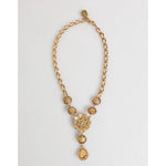 Dolce & Gabbana Gold Brass Crystal Pearl Purple Floral Pendant Jewelry Necklace with intricate chain and drop pendants.