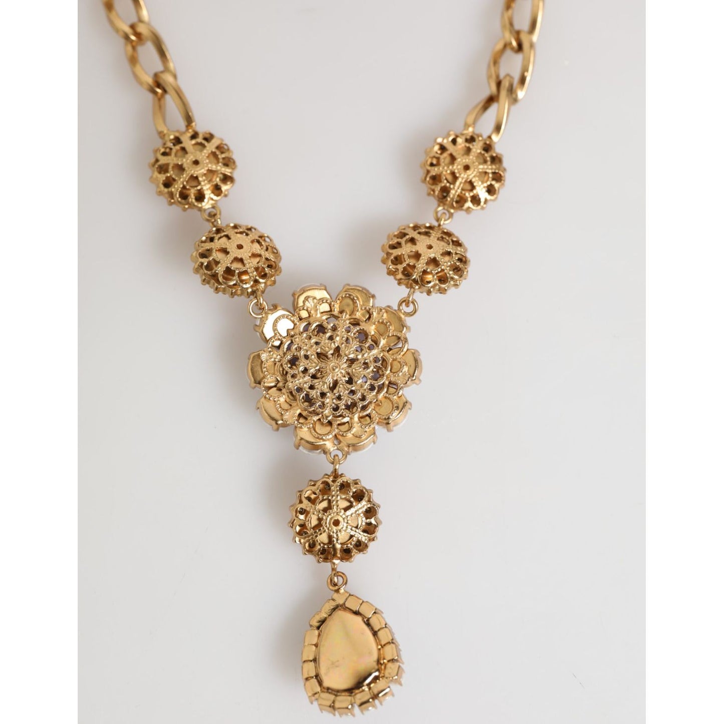 Dolce & Gabbana Gold Brass Crystal Pearl Purple Floral Pendant Jewelry Necklace with gold-tone chain and floral motif.