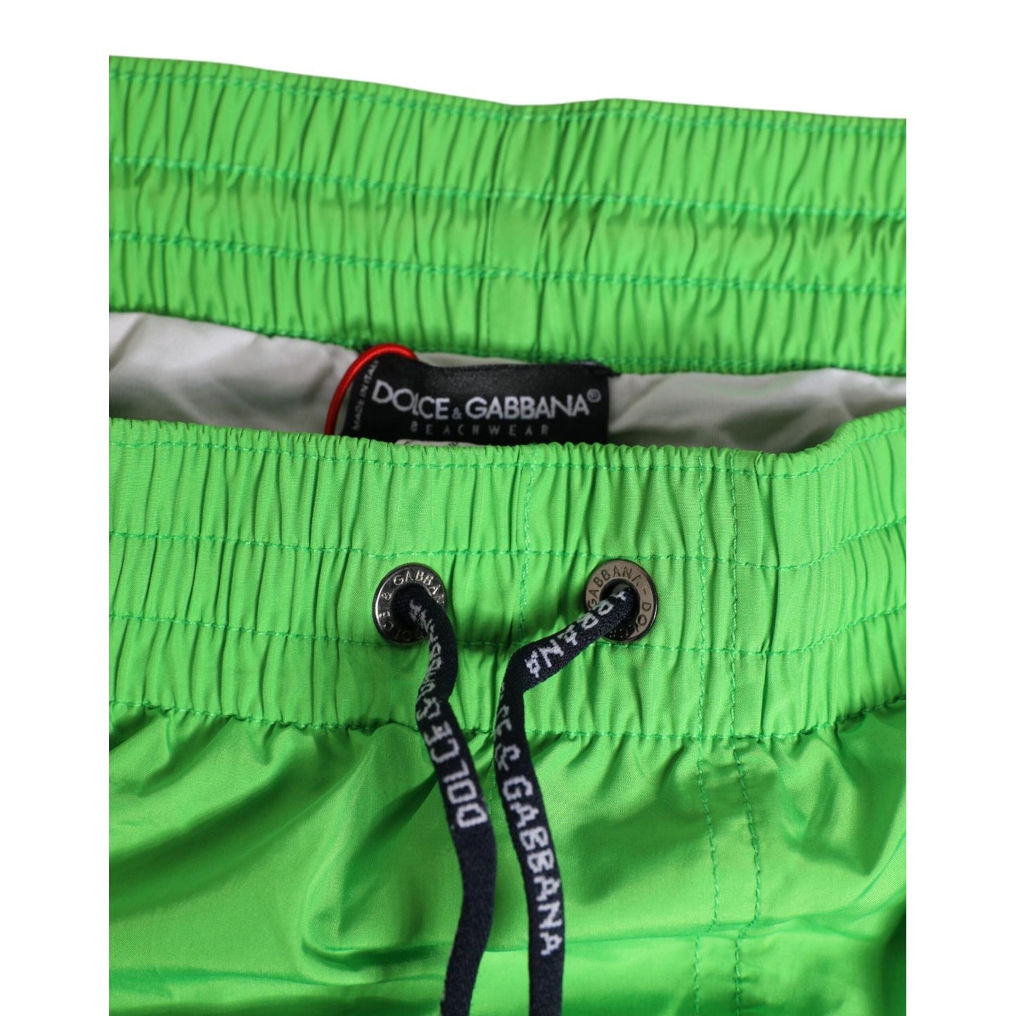 Dolce & Gabbana Green Nylon Drawstring Men Shorts Swimwear with elastic waistband and logo detailing, perfect for beachwear.