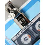 Close-up of Dolce & Gabbana Multicolor Cassette Player Box DG Music Crossbody Shoulder Bag with padlock and flower charm.