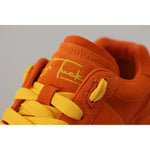 Dolce & Gabbana Orange Leather P.j. Tucker Men Sneakers Shoes with yellow laces and logo detail close-up.