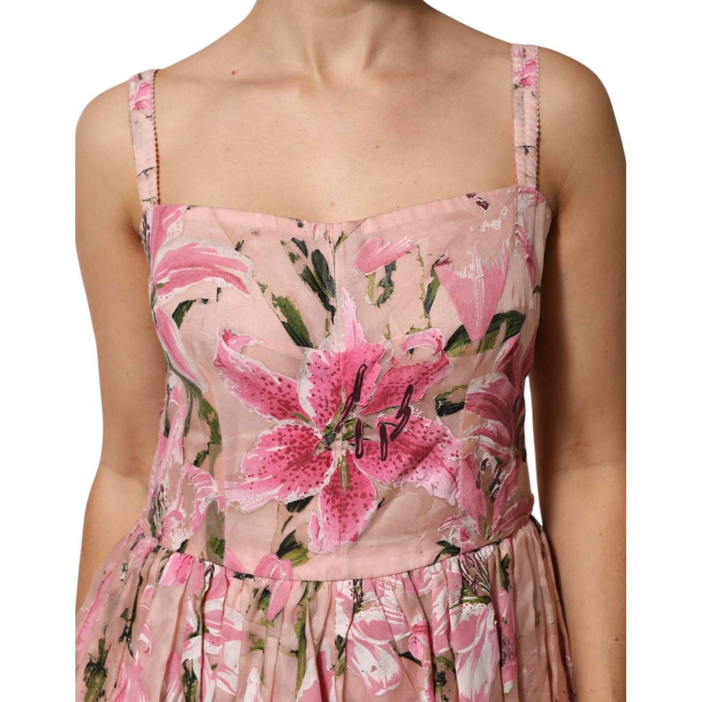 Dolce & Gabbana Pink Cotton Floral Pleated Sleeveless Dress with lily print, fitted bodice, adjustable straps, vibrant pink and green pattern.