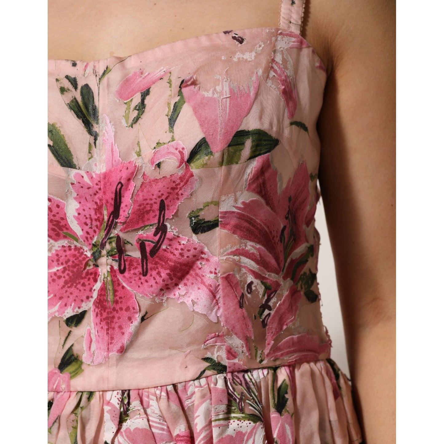 Dolce & Gabbana Pink Cotton Floral Pleated Sleeveless Dress with pink and green lily print bodice and pleated skirt detail.