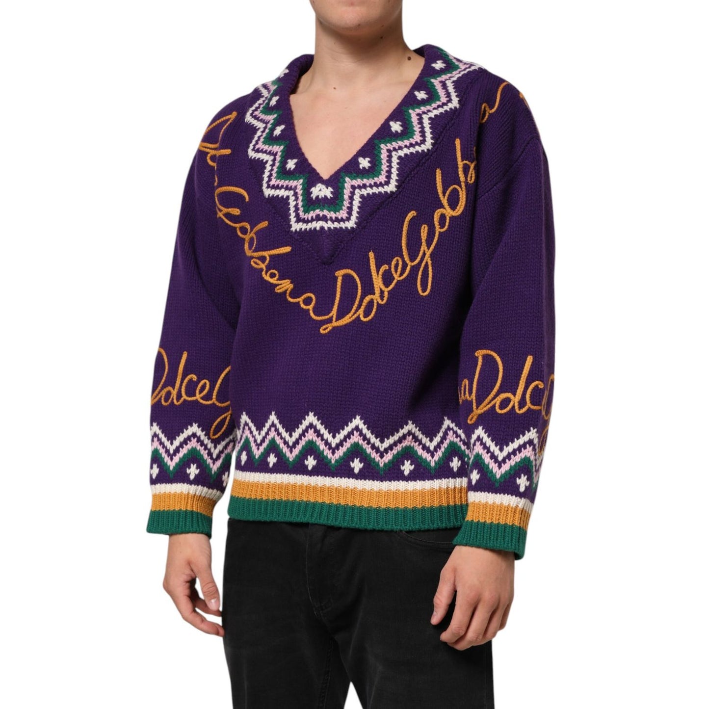 Man wearing Dolce & Gabbana Purple Wool DG Logo Men Knit Pullover Sweater featuring signature logo and vibrant design.