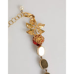 Close-up of Dolce & Gabbana Red Rose Green Crystal Gold-Tone Chain Necklace with floral design and enameled leaves.