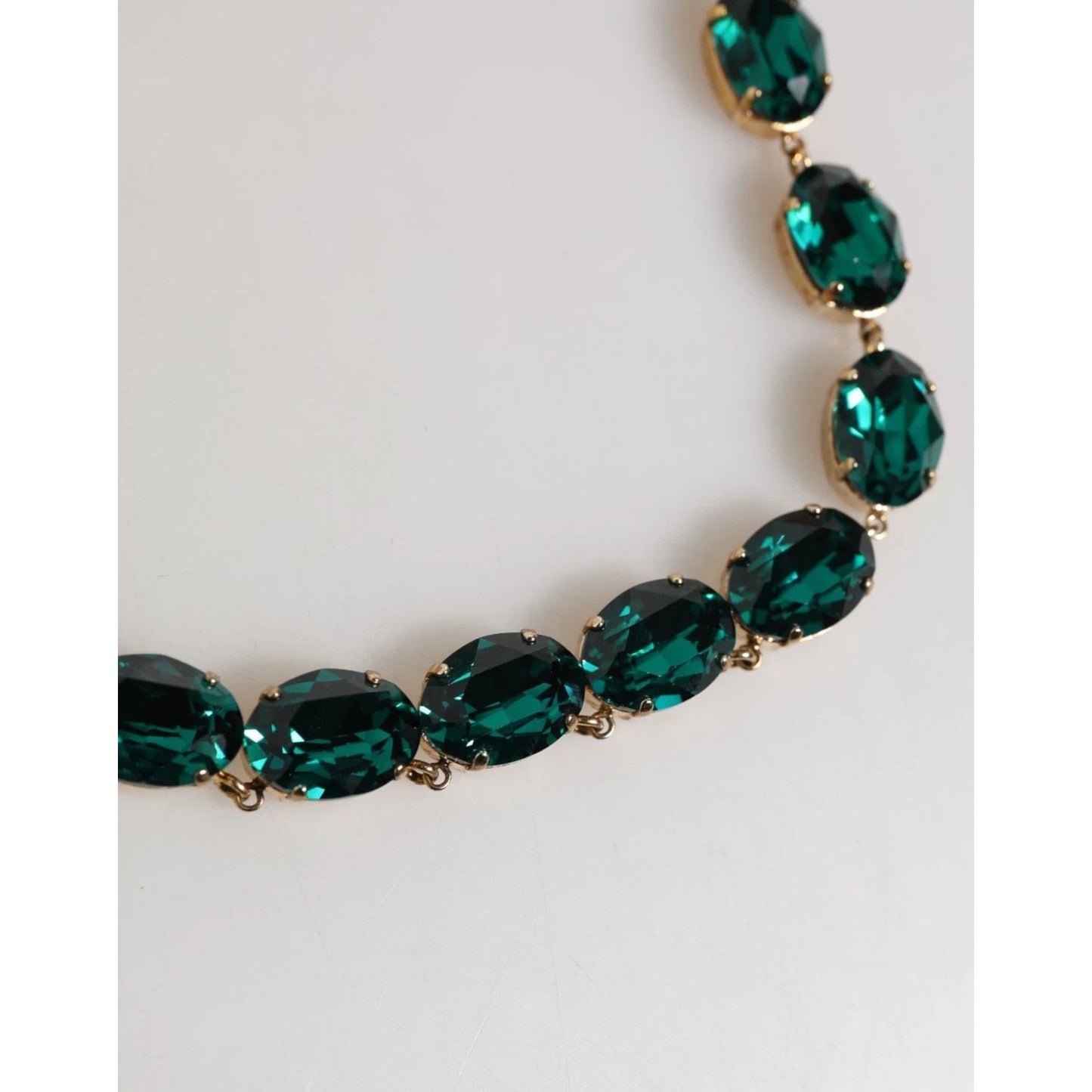 Dolce & Gabbana Red Rose Green Crystal Gold-Tone Chain Necklace with large oval-cut green crystals on a gold-tone chain close-up.