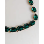 Dolce & Gabbana Red Rose Green Crystal Gold-Tone Chain Necklace with large oval-cut green crystals on a gold-tone chain close-up.