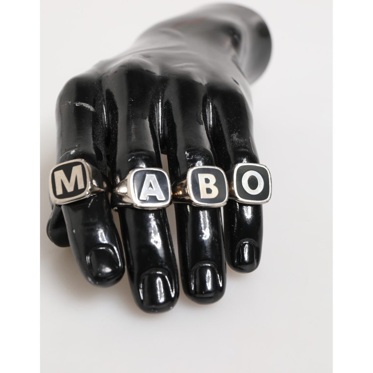 Dolce & Gabbana Silver Tone Brass Lettering Set 5 Pieces Adjustable Ring displayed on a hand model