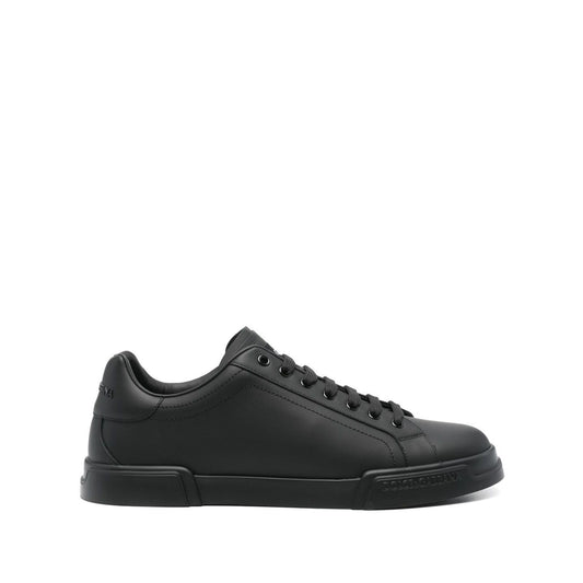 Dolce & Gabbana Sneakers Black with rubber sole, branded heel counter, and logo patch on tongue. Black lace-up DG Cushion sneakers.