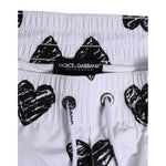 Dolce & Gabbana White Black Heart Print Men Boxer Short Swimwear with elastic waistband and drawstring closure, DG logo detail.