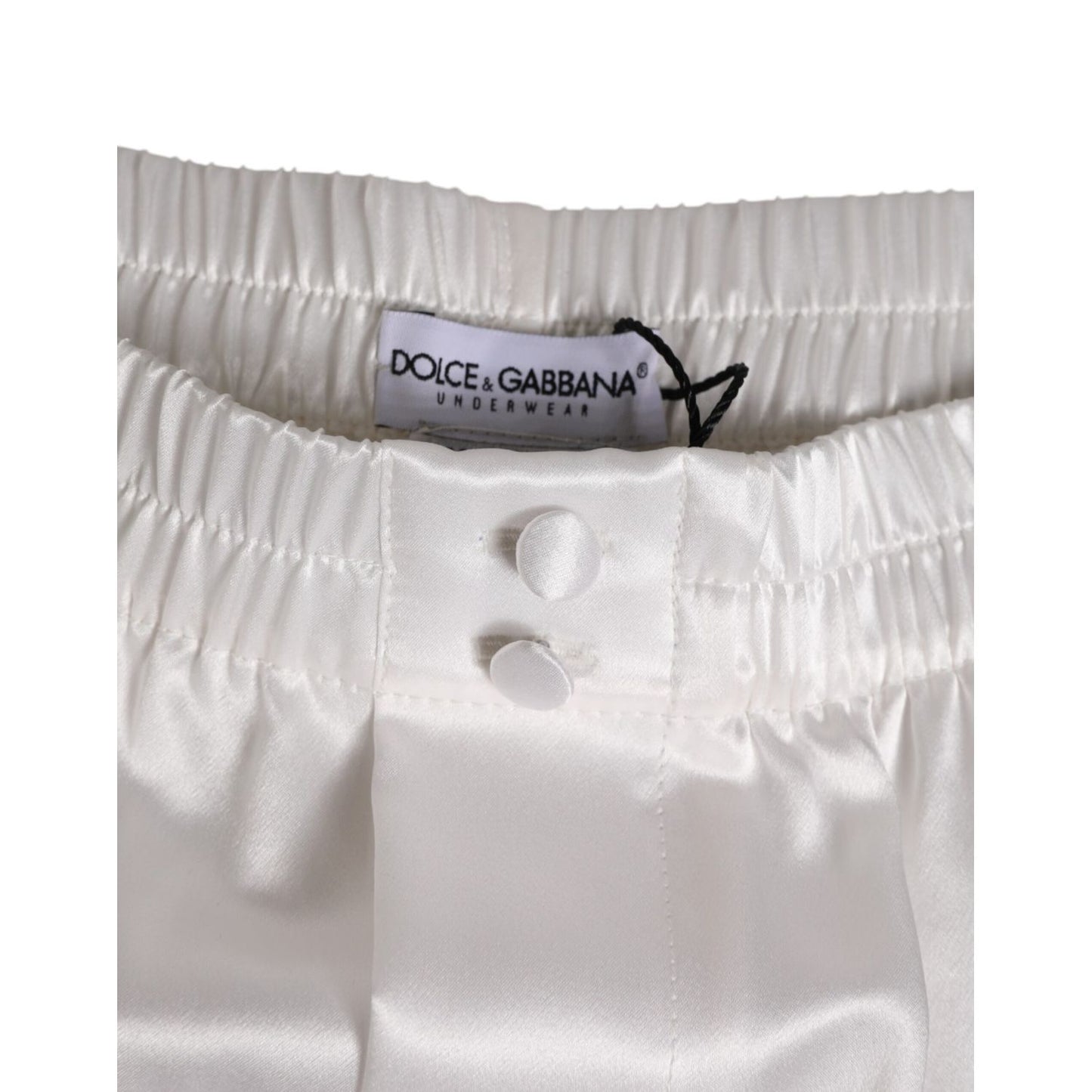 Dolce & Gabbana White Silk Satin Elastic Men Boxer Short Swimwear with button detail and logo tag, showcasing luxury craftsmanship.