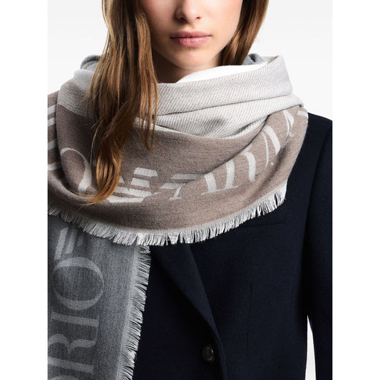 Elegant woman wearing Emporio Armani Stole with multicoloured vertical bands featuring grey logo jacquard and fringed edges.