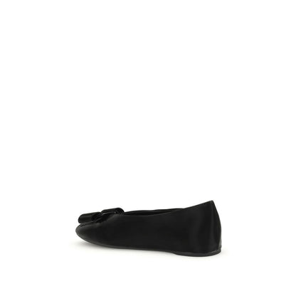 Ferragamo Black Calf Leather Bos Taurus Ballet Flats with Vara bow detail and flexible design, side view.