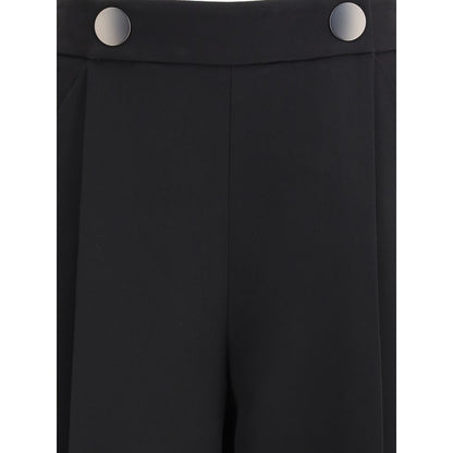 Front view of Giorgio Armani Black Silk Casual Pants with button details and side zipper closure for a sophisticated look.