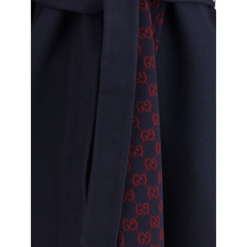 Gucci Blue Wool Coat with iconic monogram detail and removable sash, elegant and stylish design.