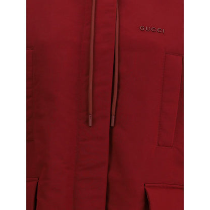 Close-up of Gucci Bordeaux Polyester Shell Jacket showing the red fabric and logo detailing.