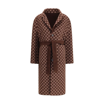 Gucci Brown Wool Coat, reversible with GG pattern, notch lapels, and button closure, offering sophistication and versatility.
