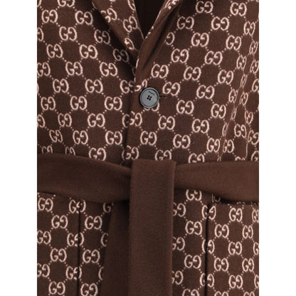Gucci Brown Wool Coat with GG pattern and button closure, featuring reversible design and elegant notch lapels for sophisticated style.