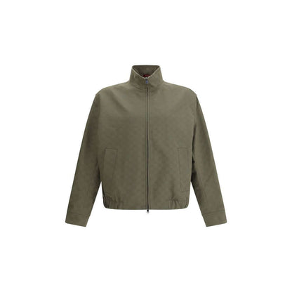 Gucci Green Cotton Bomber jacket with high collar, front zipper, side pockets, and ribbed hem. Made of 70% cotton and 30% polyester.