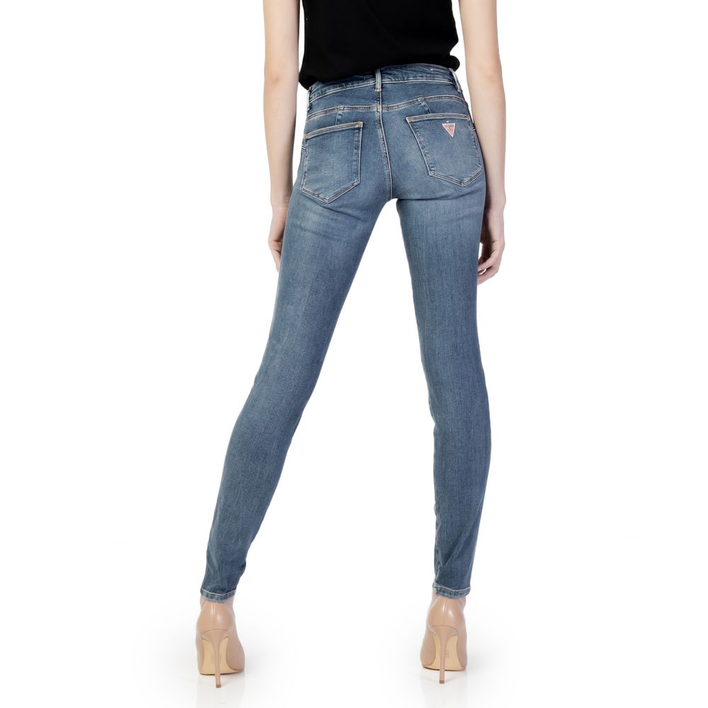 Back view of woman wearing Guess Blue Cotton Skinny Jeans, showcasing figure-hugging fit and mid-rise design for contemporary style.