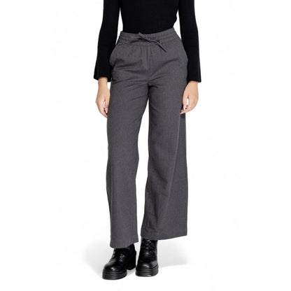 Woman wearing Jacqueline De Yong Gray Cotton Casual Pants, highlighting high waist and wide leg design for elegant comfort.