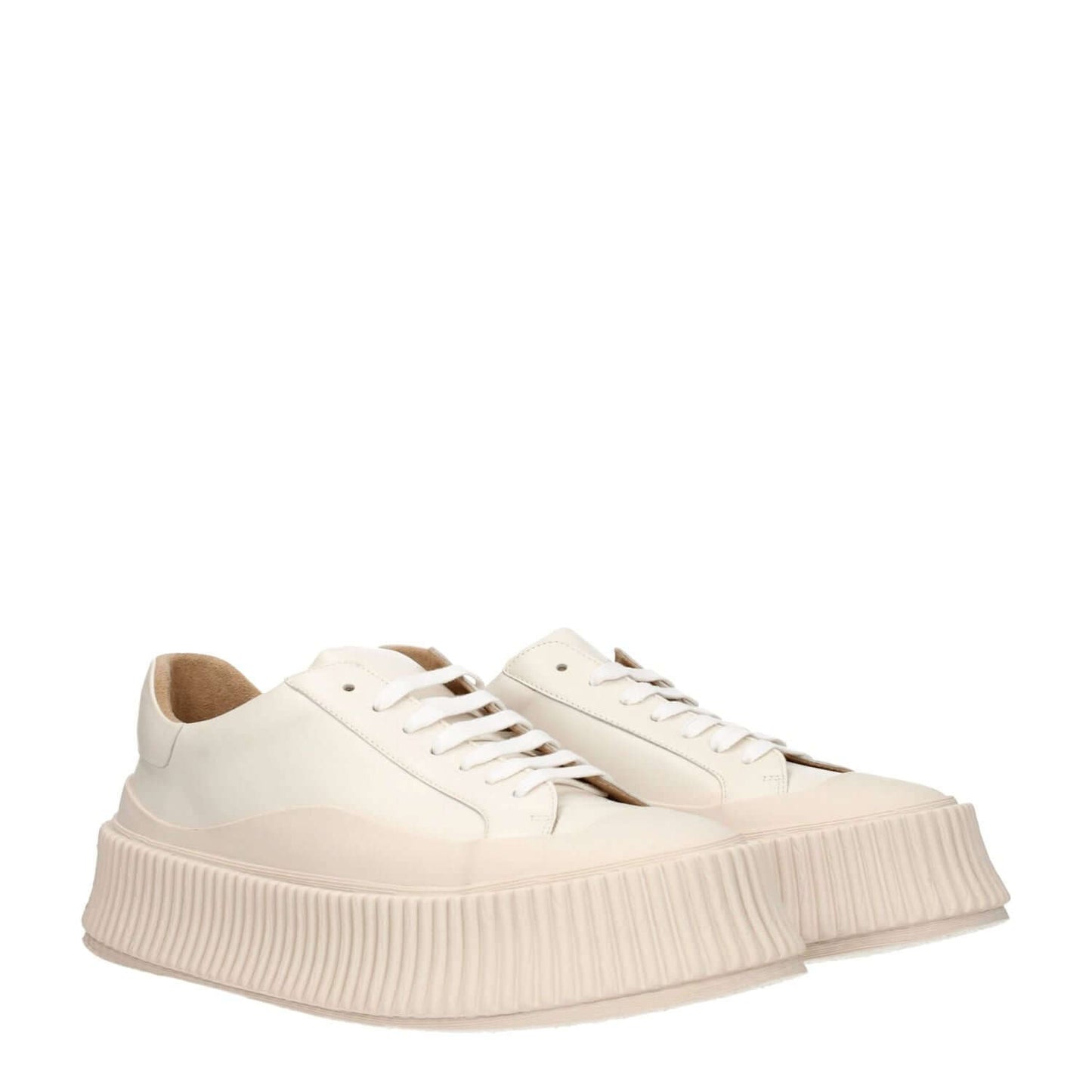 Jil Sander Beige Leather Platform Sneakers with wedge heel and lace-up closure, featuring aged effect and rubber sole.