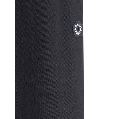 Close-up of Kenzo Black Polyester Joggers (Workout Pants) showing the iconic logo flower on a textured fabric.