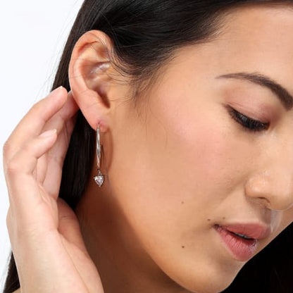 Woman wearing LA PETITE STORY JEWELRY Mod. LPS02AQM26 earrings, showcasing elegant style and modern design.