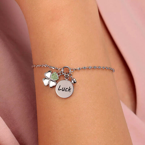 LA PETITE STORY JEWELRY Mod. LPS05ARR62 featuring a charm bracelet with 'Luck' pendant and shamrock design on a woman's wrist.