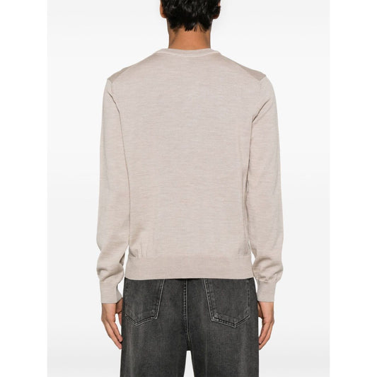 Back view of model wearing Maison Kitsuné Maison Kitsune Fox motif sweater in light beige with crew neck and ribbed cuffs.