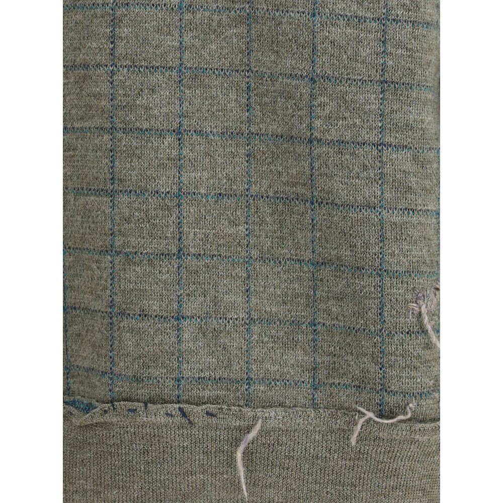 Close-up of Margiela Green Fleece Wool Sweatshirt grid pattern detail, showcasing soft wool texture for autumn-winter season style.