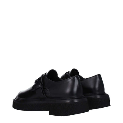 Max Mara Black Leather Oxfords And Derbies with buckle closure, low flat heels, rubber sole, and round toe.