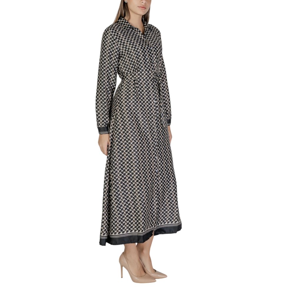 Woman wearing Only Black Recycled Polyester Long dress, part of the fall/winter collection with 68% recycled polyester.