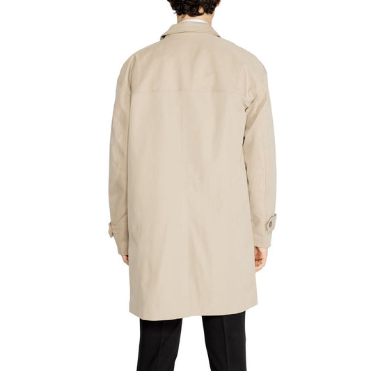 Back view of a man wearing an Only & Sons Beige Polyester Trench Coat, showcasing the minimalist design and cuff details.