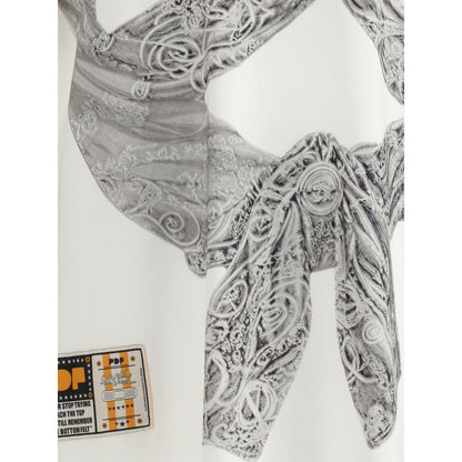 Close-up of PDF Channel The Boy White Flake T-Shirt showing graphic embossed design and fabric details.