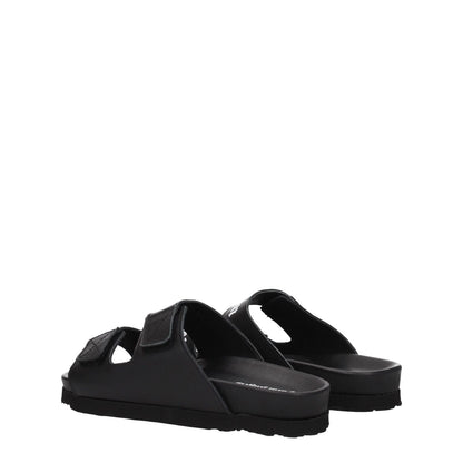 Palm Angels Black Leather Flat Sandals with strap closure and rubber sole, showcasing casual design and front logo detail.
