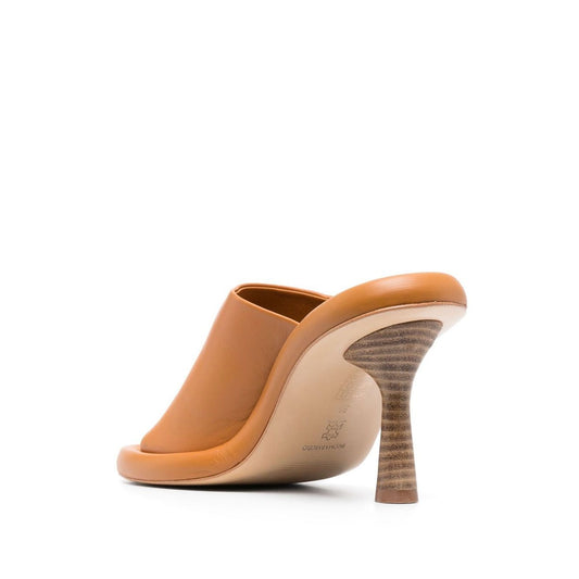 Paloma Barceló Paloma Barcelò Sandals Yellow with high sculpted heel and open toe design in calf leather.