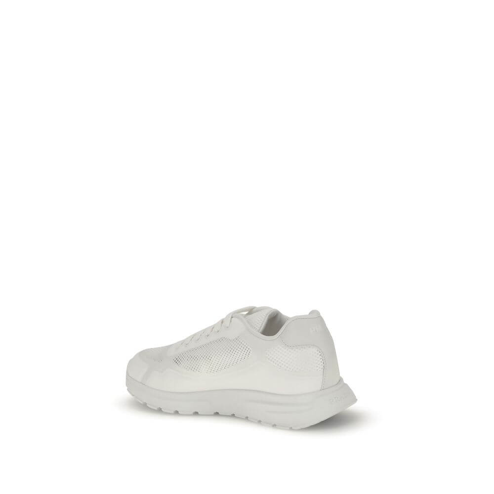 Prada White Rubber Athletic Sneakers with enameled logo and mesh design, featuring a rubber sole and polyester lace-up closure, side view.