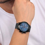 Gent wearing SECTOR Mod. 670 wristwatch, 45mm silver case, quartz multifunction, stylish design for men.