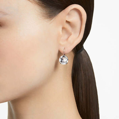 SWAROVSKI Mod. 5628351 lady's earrings in silver, quartz analog, 38 mm mineral case, 5 ATM water-resistant, shown on ear model.