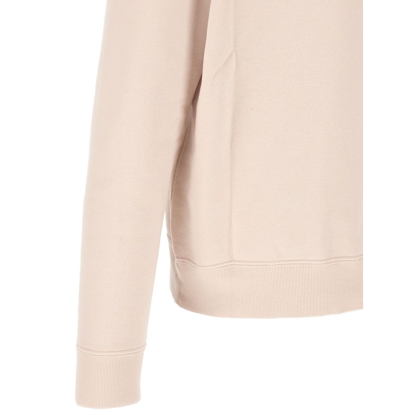 Saint Laurent Sweaters Powder in pink cotton, crew neck with long cuffed sleeves, shown in side view.
