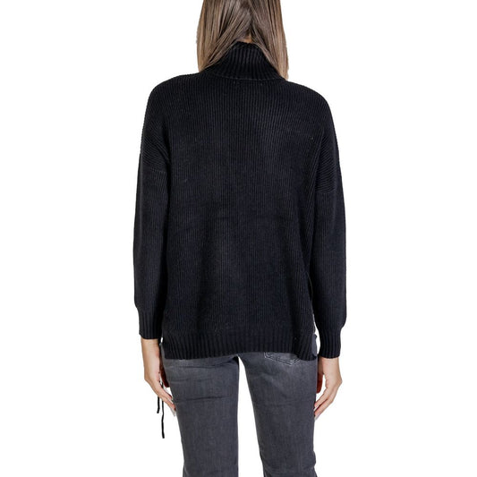 Back view of Sandro Ferrone Black Viscose Turtleneck women's sweater with fine ribbed knitting.