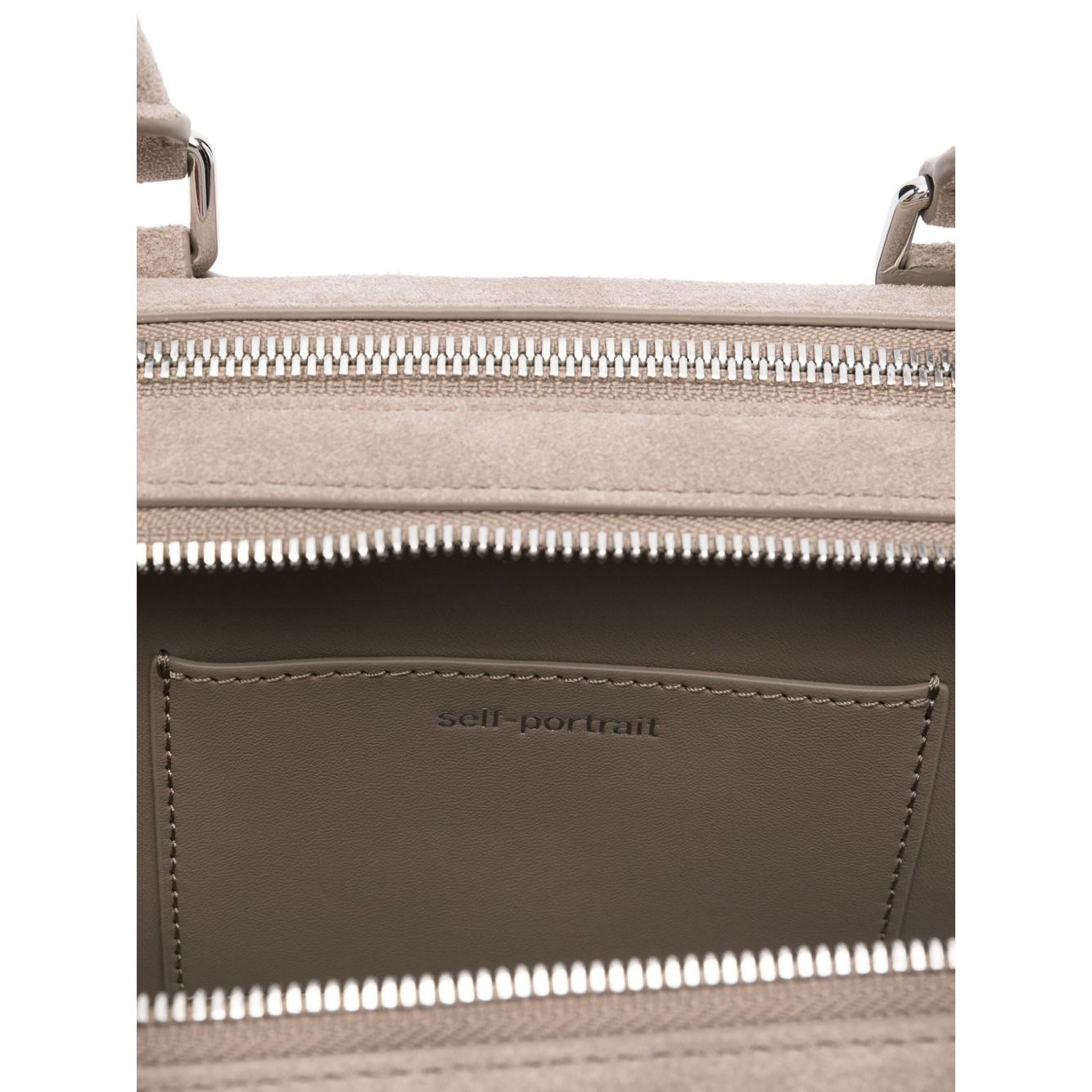 Front view with bag zipped and handles upright.